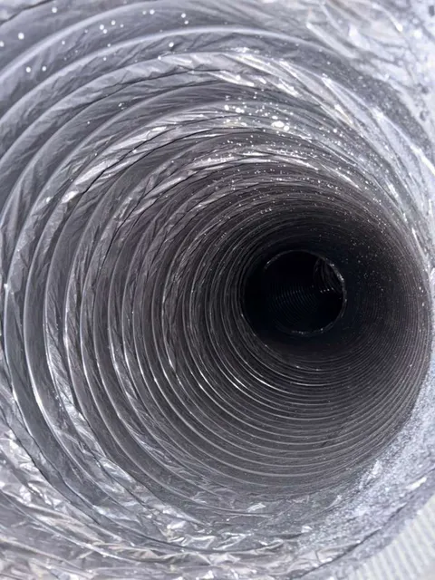 Dusty flex duct before cleaning in Southlake TX