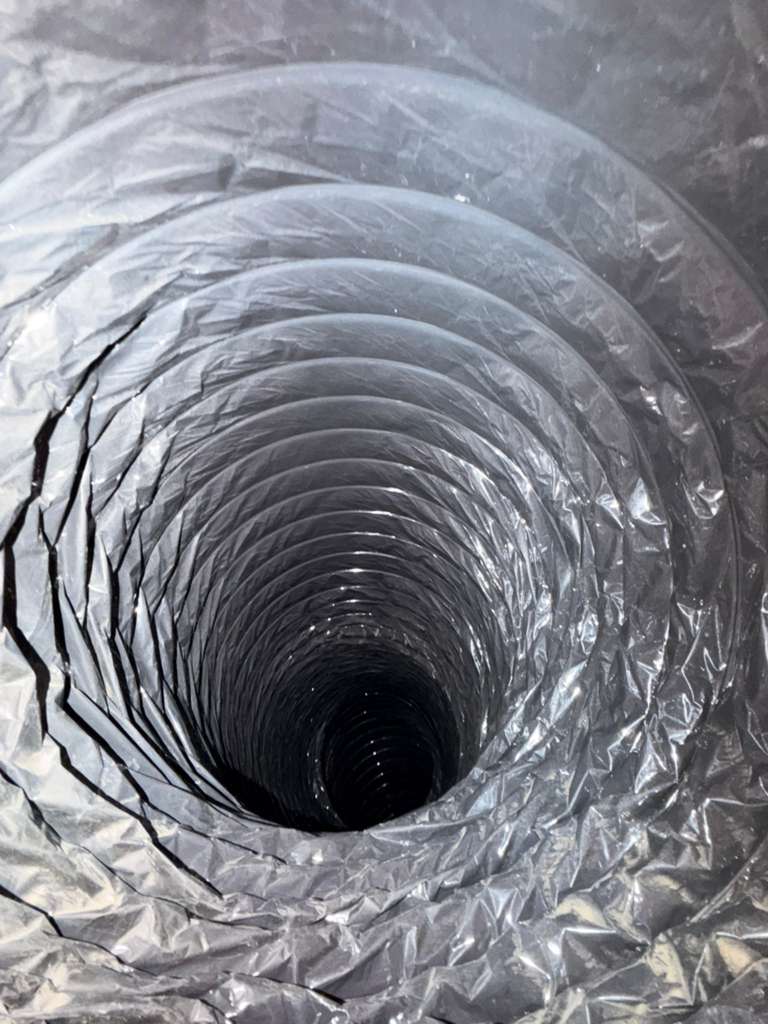 Bloom Air Duct Cleaning team member servicing home in Dallas TX