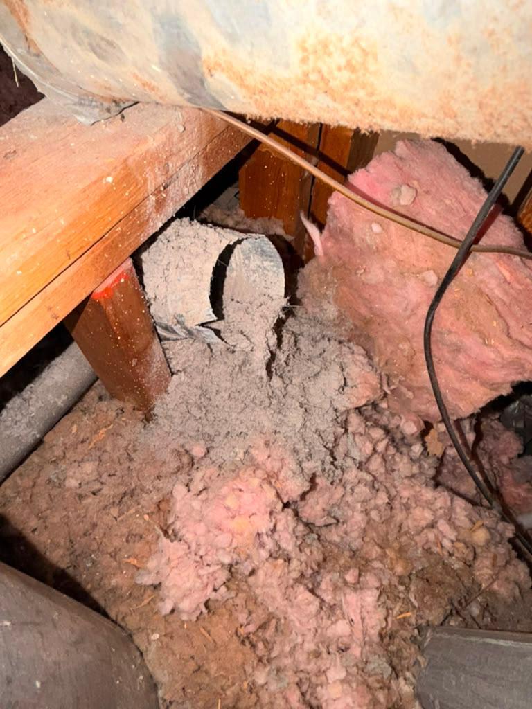 Clogged dryer vent duct disconnected in a Lakewood Dallas attic before cleaning