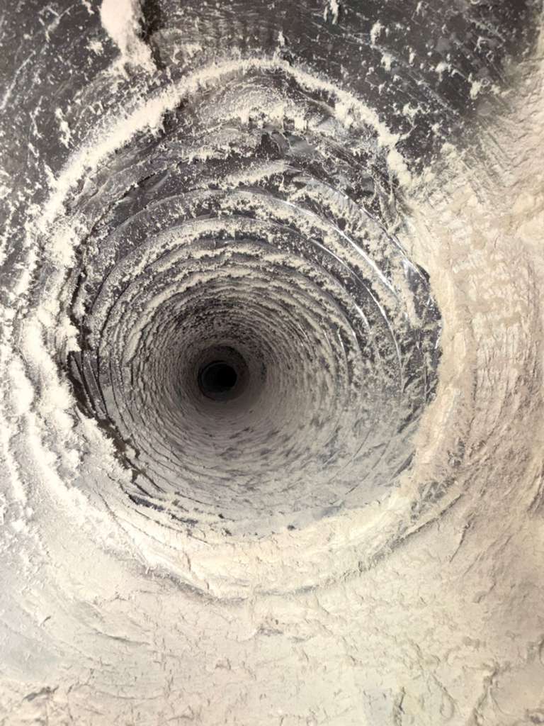 White mold-like growth inside an air duct in a Flower Mound TX home before cleaning